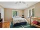 Bedroom with hardwood floors, two windows and a closet at 1024 Lake Charles Dr, Roswell, GA 30075