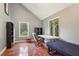 Bonus room features hardwood floors, natural light, vaulted ceiling and neutral paint at 1024 Lake Charles Dr, Roswell, GA 30075