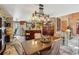 An eclectic dining room featuring vintage cabinets, an island with bar seating, and unique lighting fixtures at 1024 Lake Charles Dr, Roswell, GA 30075