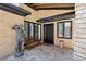 Close up of front entrance showcasing stone pathway, bench, statue, and black door and window trim at 1024 Lake Charles Dr, Roswell, GA 30075