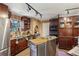 Well-equipped kitchen with stainless steel appliances, custom cabinets, and a stone accent wall at 1024 Lake Charles Dr, Roswell, GA 30075