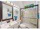 A stylish bathroom features a glass-enclosed shower and a modern vanity with a decorative mirror at 105 Postwood Dr, Fayetteville, GA 30215