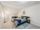 Comfortable carpeted bedroom under the eaves with natural light and stylish decor at 105 Postwood Dr, Fayetteville, GA 30215