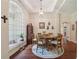 Light-filled dining room with arched window, tray ceilings, and neutral decor at 105 Postwood Dr, Fayetteville, GA 30215