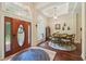Elegant foyer with wood floors, light fixtures, and an arched window for natural light at 105 Postwood Dr, Fayetteville, GA 30215