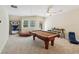 Spacious game room featuring a pool table, bar, and comfortable seating at 105 Postwood Dr, Fayetteville, GA 30215