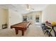 Spacious game room featuring a pool table, bar, and comfortable seating at 105 Postwood Dr, Fayetteville, GA 30215