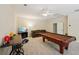 Spacious game room featuring a pool table, bar, and comfortable seating at 105 Postwood Dr, Fayetteville, GA 30215