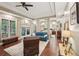 Spacious main bedroom featuring hardwood floors, large windows, and patio access at 105 Postwood Dr, Fayetteville, GA 30215