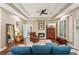 Main bedroom with hardwood floors featuring a ceiling fan and a patio at 105 Postwood Dr, Fayetteville, GA 30215