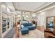 Large main bedroom features a blue sofa and private patio access at 105 Postwood Dr, Fayetteville, GA 30215