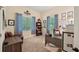 A bright office featuring a large window, desk, and unique wall decor at 105 Postwood Dr, Fayetteville, GA 30215