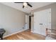 Bedroom with a ceiling fan, hardwood floors, and a double door closet for ample storage at 1270 Taylor Oaks Dr, Roswell, GA 30076