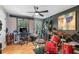 Versatile bonus room with hardwood floors, a ceiling fan, plenty of natural light, and a sound-proof wall at 1270 Taylor Oaks Dr, Roswell, GA 30076