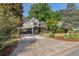 Well-maintained two-story home with an attached garage and a long driveway leading to the entrance at 1270 Taylor Oaks Dr, Roswell, GA 30076