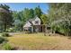 Charming home with a pergola and front yard landscaping, enhancing curb appeal at 1270 Taylor Oaks Dr, Roswell, GA 30076