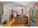 Well-lit kitchen with wooden cabinetry, modern appliances, and a charming breakfast nook, seamlessly connecting indoor and outdoor spaces at 1270 Taylor Oaks Dr, Roswell, GA 30076