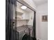 Functional laundry room with modern washer and dryer units and built-in shelving for convenient storage at 1270 Taylor Oaks Dr, Roswell, GA 30076