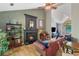 Living room showcasing hardwood floors, a fireplace, and a comfortable seating arrangement at 1270 Taylor Oaks Dr, Roswell, GA 30076