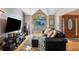 Bright living room with hardwood floors, a comfortable couch, and a view of the front yard at 1270 Taylor Oaks Dr, Roswell, GA 30076