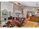 Bright, open living room featuring vaulted ceilings, unique hardwood floors and an elegant decorative sofa at 1270 Taylor Oaks Dr, Roswell, GA 30076