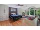 Spacious main bedroom with hardwood floors, a large window with nature views, and built-in cabinets at 1270 Taylor Oaks Dr, Roswell, GA 30076