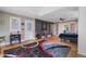 Bright and airy main bedroom boasts hardwood floors, a stylish rug, an exterior door, and nature views at 1270 Taylor Oaks Dr, Roswell, GA 30076