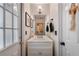 Charming powder room with white vanity, framed mirror, and stylish decor, conveniently located near an entry door at 1270 Taylor Oaks Dr, Roswell, GA 30076
