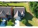 Aerial view of the house with manicured lawn and driveway at 2600 Arnold Palmer Way, Duluth, GA 30096