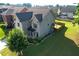 Aerial view of the house with large grassy area and wooden fence at 2600 Arnold Palmer Way, Duluth, GA 30096