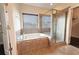 Bathroom features a soaking tub, walk-in shower, and tile flooring at 2600 Arnold Palmer Way, Duluth, GA 30096