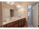 Bathroom featuring double sinks, a large mirror, and updated fixtures with great natural lighting at 2600 Arnold Palmer Way, Duluth, GA 30096