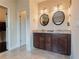 Bathroom featuring a double vanity with granite countertops and stylish lighting at 2600 Arnold Palmer Way, Duluth, GA 30096