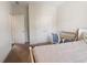 Bright bedroom features double door closet, plush carpeting, a workspace, and natural light from the window at 2600 Arnold Palmer Way, Duluth, GA 30096