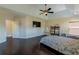Large bedroom with hardwood floors, a ceiling fan, and plenty of natural light at 2600 Arnold Palmer Way, Duluth, GA 30096