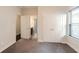 Bright bedroom features double door closet, plush carpeting, and natural light from the window at 2600 Arnold Palmer Way, Duluth, GA 30096