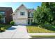 Charming two-story home with a well-manicured lawn and attached two-car garage at 2600 Arnold Palmer Way, Duluth, GA 30096
