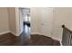 Upstairs hallway with hardwood flooring shows access to a bedroom at 2600 Arnold Palmer Way, Duluth, GA 30096