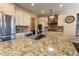 Gourmet kitchen features stainless steel appliances, granite countertops, and a large island at 2600 Arnold Palmer Way, Duluth, GA 30096