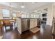 Modern kitchen seamlessly integrates with dining and living spaces at 2600 Arnold Palmer Way, Duluth, GA 30096