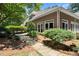 Landscaped backyard featuring a stone path and lush greenery, enhancing the curb appeal of the house at 5455 Malone Ct, Powder Springs, GA 30127