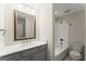Bright bathroom with a bathtub and shower combination at 5455 Malone Ct, Powder Springs, GA 30127