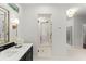 Modern bathroom featuring a sleek vanity, glass shower, and elegant fixtures at 5455 Malone Ct, Powder Springs, GA 30127