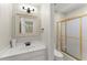 This bathroom features a modern vanity, framed mirror, and a glass enclosed shower at 5455 Malone Ct, Powder Springs, GA 30127