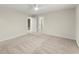 This bedroom has neutral walls, carpet, a ceiling fan, and an open door to another room at 5455 Malone Ct, Powder Springs, GA 30127