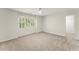 This bedroom is well-lit and has neutral walls, carpet and a ceiling fan at 5455 Malone Ct, Powder Springs, GA 30127