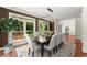 Dining room with a modern light fixture and a large window with an outdoor view at 5455 Malone Ct, Powder Springs, GA 30127