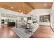 Spacious living area showing an open concept to the kitchen with stainless appliances and island with bar stool seating at 5455 Malone Ct, Powder Springs, GA 30127