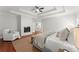 Cozy main bedroom featuring a fireplace, chair, king bed, and a neutral color scheme at 5455 Malone Ct, Powder Springs, GA 30127