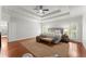 Bright main bedroom with ample space features a tray ceiling, area rug, and a king bed at 5455 Malone Ct, Powder Springs, GA 30127